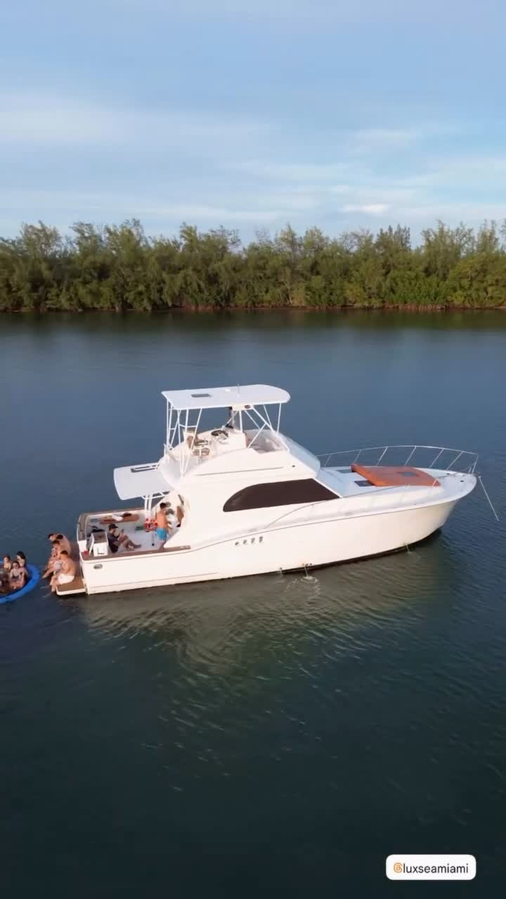 The Chris Craft anchored close to the mangroves with family aboard