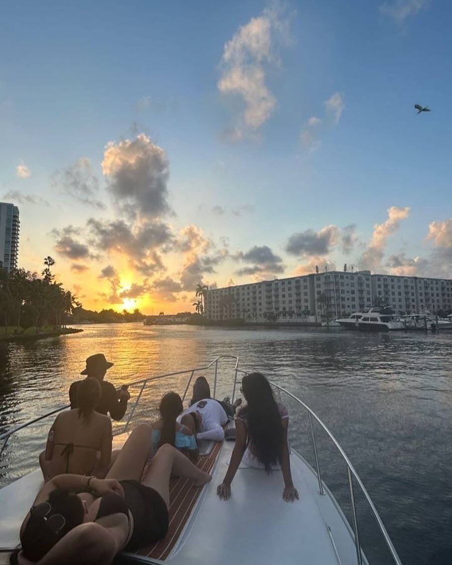 The sun going down over the bay, seen from the bow of the boat