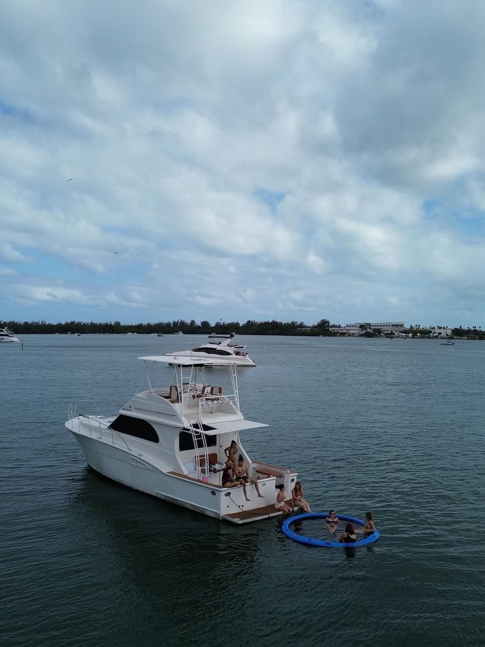 The Chris Craft at anchor with the swim float streamed off the stern