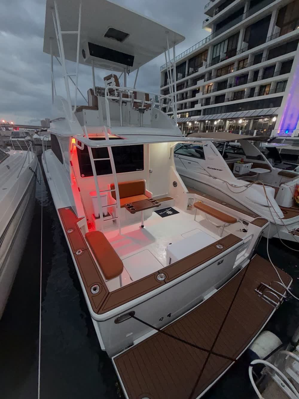 The cockpit lit up alongside the dock at night