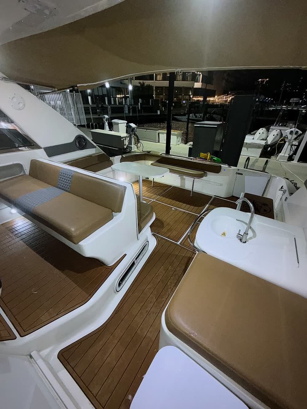 The cockpit at night alongside the dock