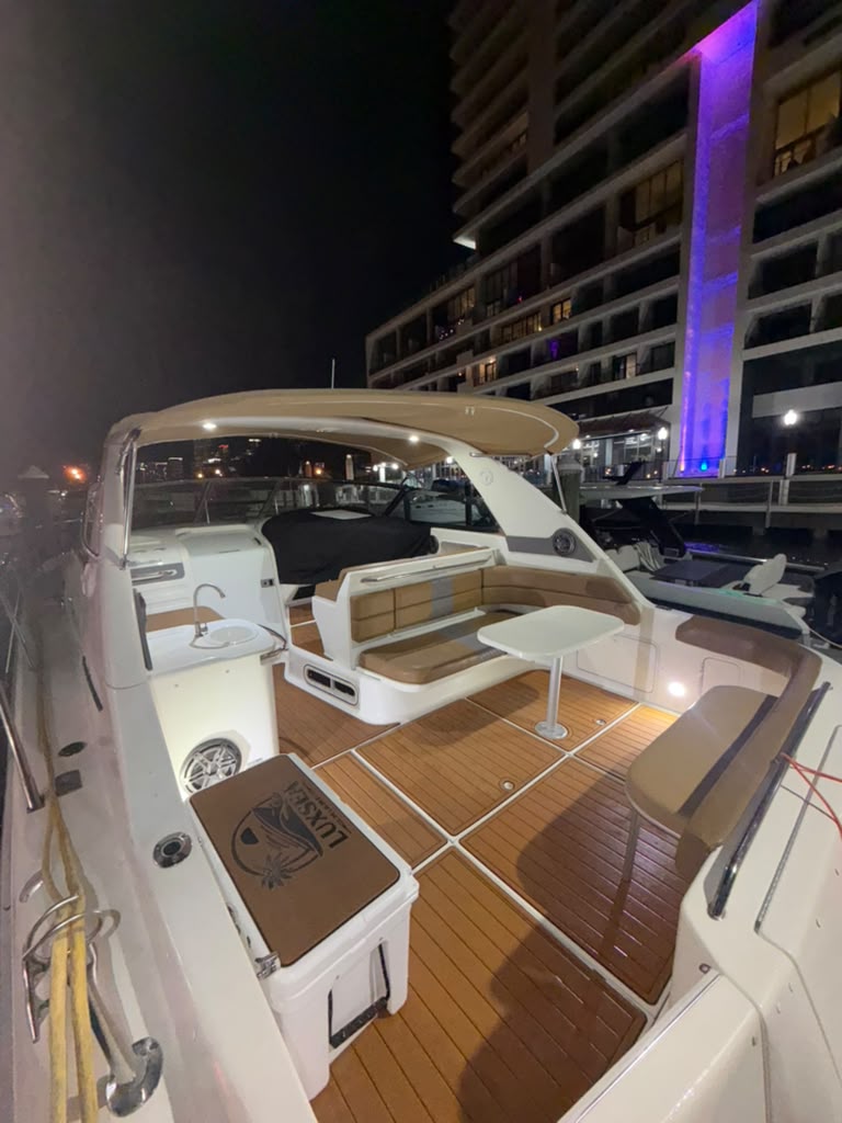 The cockpit and wet bar alongside the dock after dark