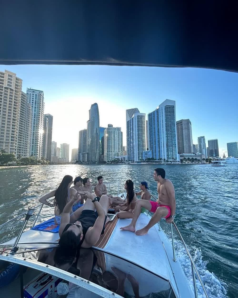 Guests on the bow with the Brickell towers filling the background